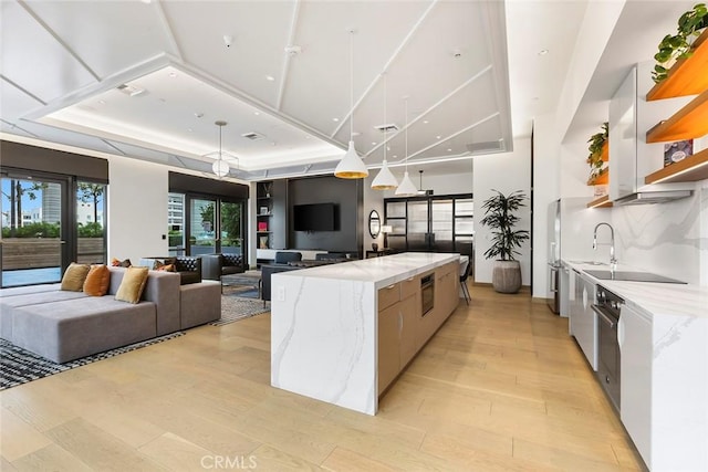 400 S Broadway Unit 1701, Los Angeles, CA 90013 - kitchen with modern cabinets, open shelves, light wood finished floors, and white cabinetry