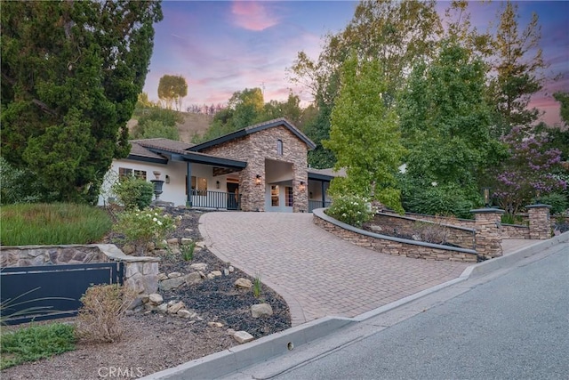 235 Verbena Ln, Brea, CA 92823 - view of front of home with decorative driveway and stone siding