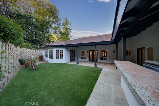 235 Verbena Ln, Brea, CA 92823 - rear view of house with stucco siding, a patio area, and french doors