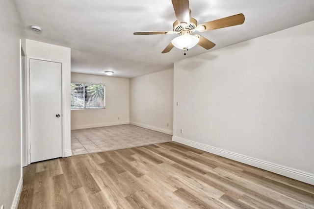 2850 Reynard Way Unit 10, San Diego, CA 92103 - spare room featuring a smoke detector, wood finished floors, and a ceiling fan