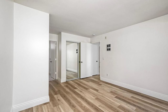 2850 Reynard Way Unit 10, San Diego, CA 92103 - unfurnished bedroom featuring light wood-style flooring and a closet
