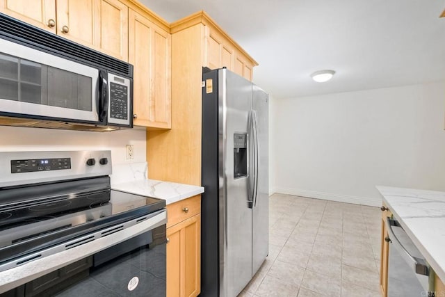 2850 Reynard Way Unit 10, San Diego, CA 92103 - kitchen featuring stainless steel appliances, light brown cabinets, light stone counters, and light tile patterned floors