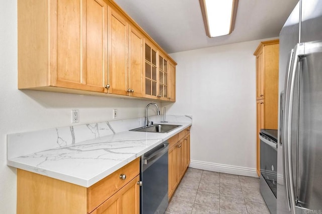 2850 Reynard Way Unit 10, San Diego, CA 92103 - kitchen featuring appliances with stainless steel finishes, glass insert cabinets, light tile patterned floors, and light stone counters