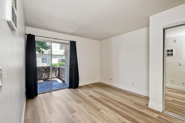 2850 Reynard Way Unit 10, San Diego, CA 92103 - unfurnished room with light wood-style flooring and baseboards
