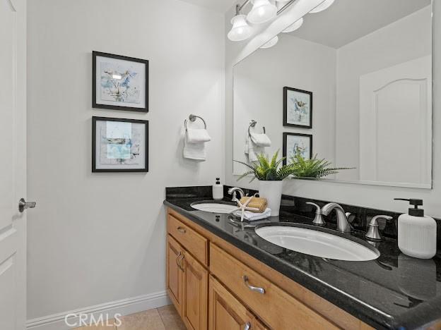 22601 Aguadero Pl, Saugus, CA 91350 - bathroom with double vanity and tile patterned flooring