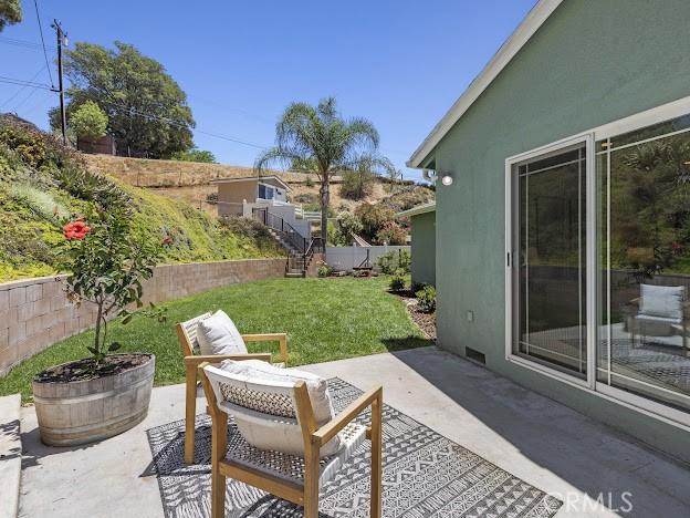 22601 Aguadero Pl, Saugus, CA 91350 - fenced backyard featuring a patio area