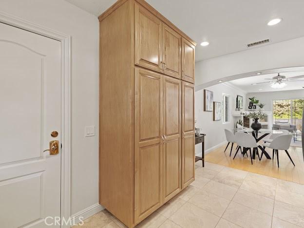 22601 Aguadero Pl, Saugus, CA 91350 - kitchen featuring arched walkways, a ceiling fan, recessed lighting, and light tile patterned floors