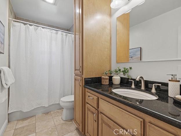 22601 Aguadero Pl, Saugus, CA 91350 - full bath featuring vanity, tile patterned flooring, and shower / bath combo