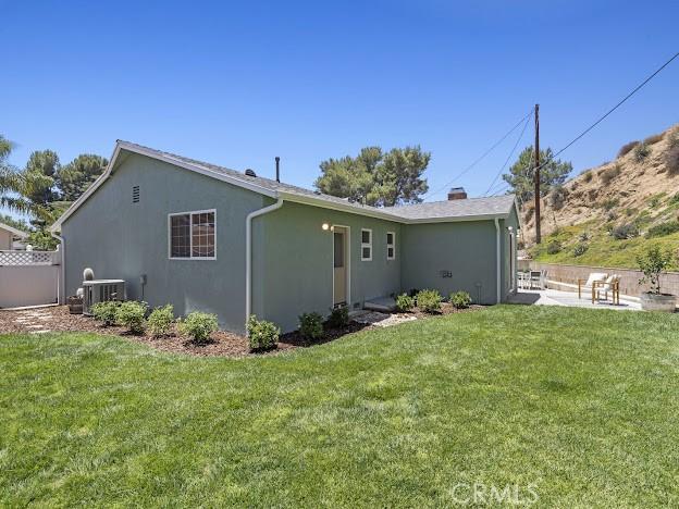 22601 Aguadero Pl, Saugus, CA 91350 - back of property featuring stucco siding and a patio
