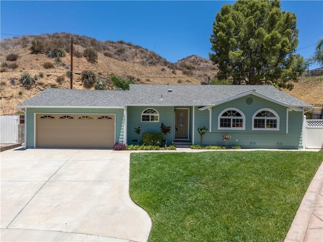 22601 Aguadero Pl, Saugus, CA 91350 - ranch-style house featuring concrete driveway, an attached garage, a mountain view, and a shingled roof