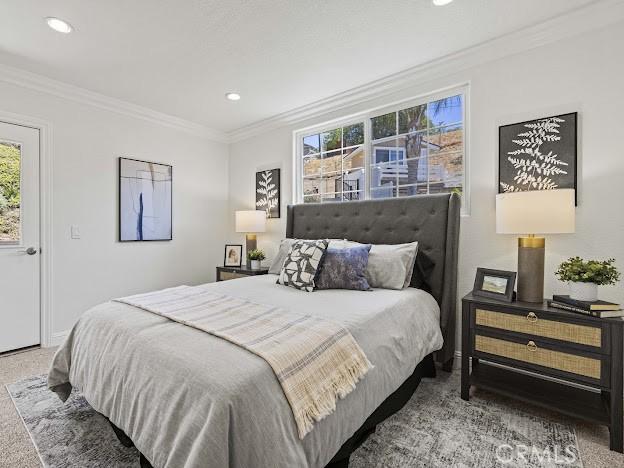 22601 Aguadero Pl, Saugus, CA 91350 - bedroom with carpet floors, multiple windows, recessed lighting, and ornamental molding