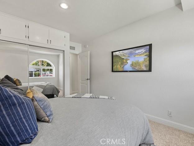 22601 Aguadero Pl, Saugus, CA 91350 - carpeted bedroom with a closet and recessed lighting