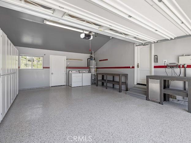 22601 Aguadero Pl, Saugus, CA 91350 - garage featuring independent washer and dryer, a garage door opener, and secured water heater