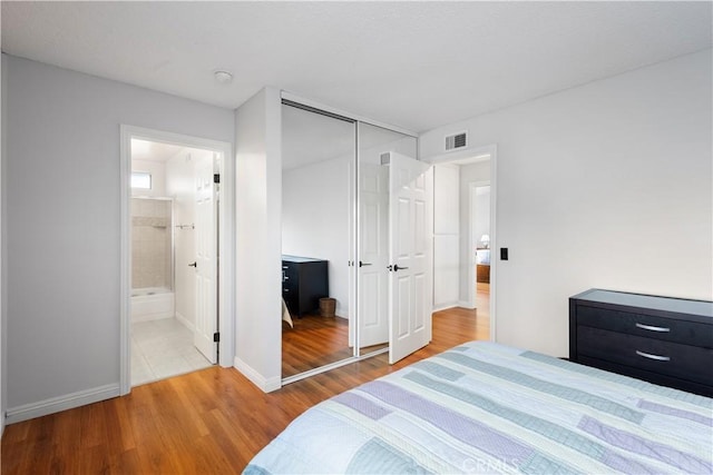 1317 Mill Creek Ct, Thousand Oaks, CA 91360 - bedroom with wood finished floors, connected bathroom, and a closet