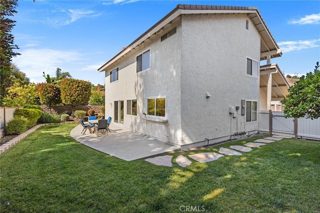 1317 Mill Creek Ct, Thousand Oaks, CA 91360 - rear view of house with a fenced backyard, stucco siding, a patio area, and a gate