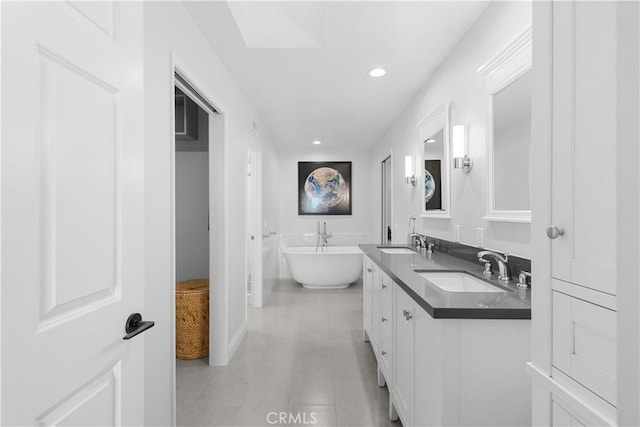 1317 Mill Creek Ct, Thousand Oaks, CA 91360 - bathroom featuring double vanity, a freestanding bath, recessed lighting, and tile patterned flooring