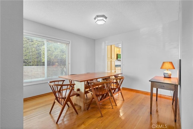 1317 Mill Creek Ct, Thousand Oaks, CA 91360 - dining space featuring light wood-style floors and a textured ceiling