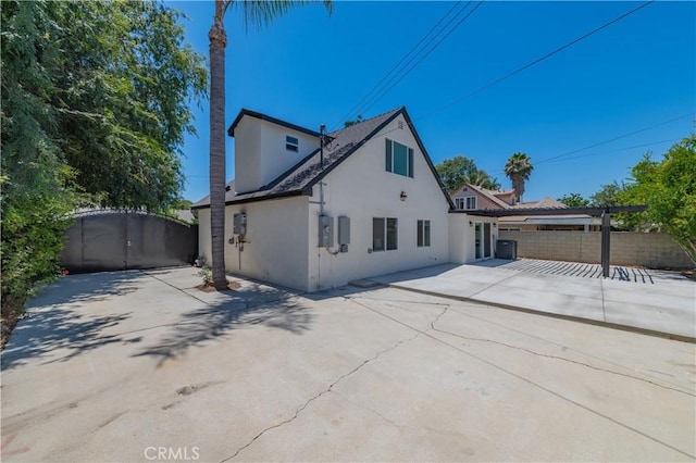 16645 Holton St, La Puente, CA 91744 - back of property featuring stucco siding, a gate, and a patio area