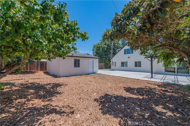 16645 Holton St, La Puente, CA 91744 - rear view of house featuring a patio area, stucco siding, and an outdoor structure