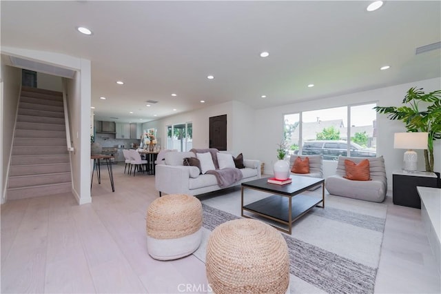 16645 Holton St, La Puente, CA 91744 - living area with recessed lighting, stairs, and light wood-style floors