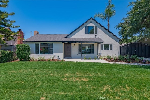 16645 Holton St, La Puente, CA 91744 - view of front of home featuring stucco siding, a front yard, a chimney, and a porch