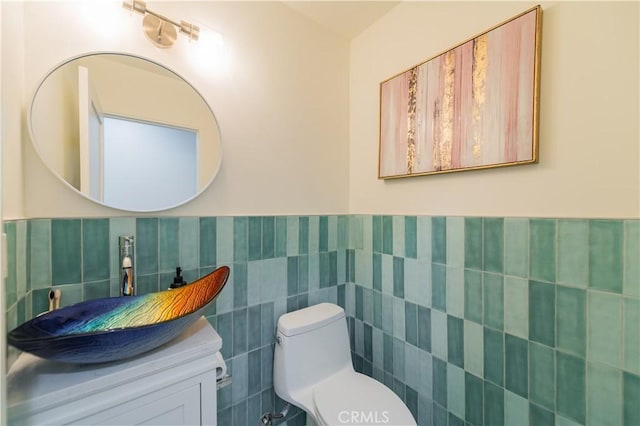 16645 Holton St, La Puente, CA 91744 - half bath with tile walls, vanity, and a wainscoted wall