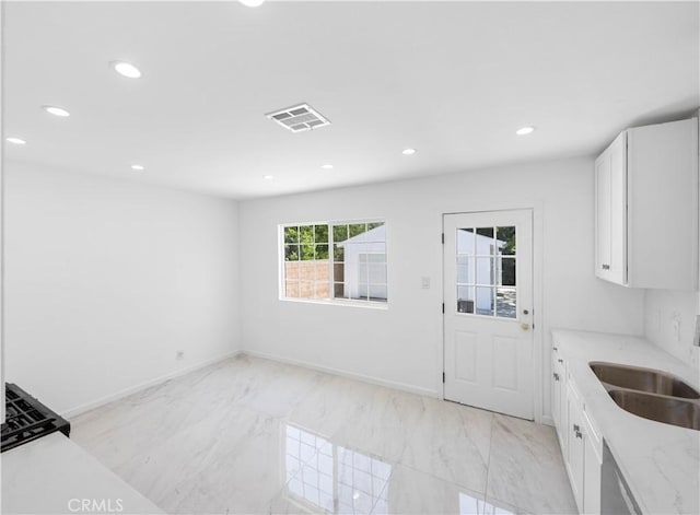6846 Wystone Ave, Reseda, CA 91335 - kitchen featuring recessed lighting, white cabinetry, light stone countertops, light marble finish flooring, and stainless steel dishwasher