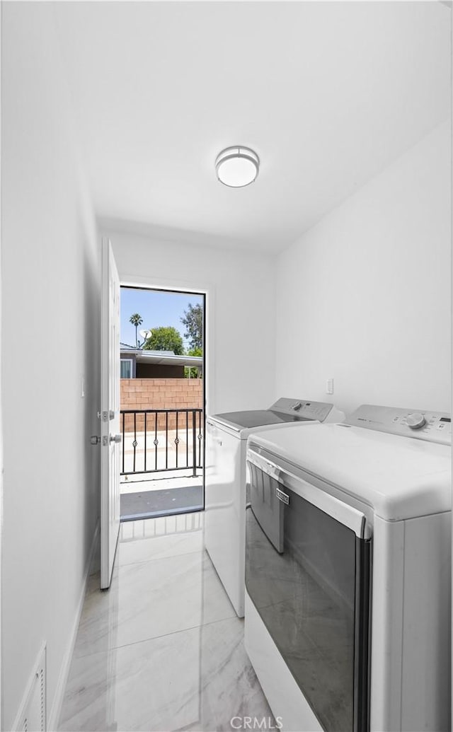 6846 Wystone Ave, Reseda, CA 91335 - laundry room featuring washer and clothes dryer and light marble finish floors