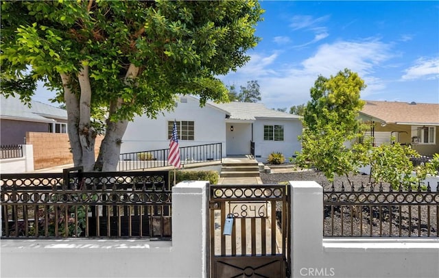 6846 Wystone Ave, Reseda, CA 91335 - view of front of home with a fenced front yard, a gate, and stucco siding