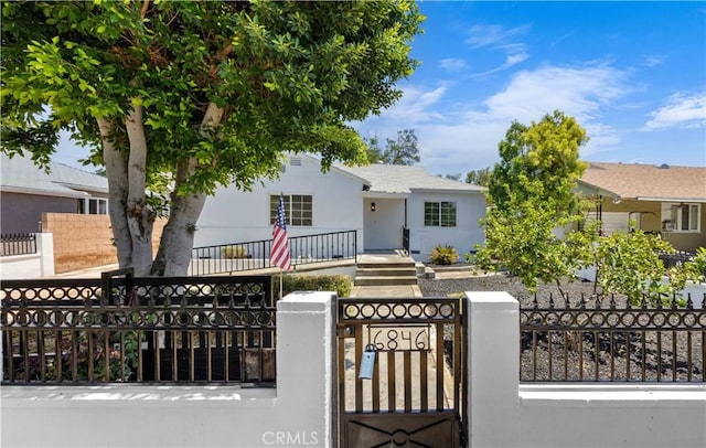 6846 Wystone Ave, Reseda, CA 91335 - view of front facade featuring a fenced front yard, a gate, and stucco siding