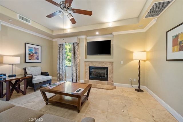 2727 Shell Beach Rd Unit 219, Pismo Beach, CA 93449 - living area featuring a raised ceiling, a high end fireplace, ceiling fan, and crown molding