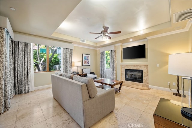 2727 Shell Beach Rd Unit 219, Pismo Beach, CA 93449 - living area featuring a tray ceiling, ceiling fan, a tile fireplace, light tile patterned floors, and recessed lighting
