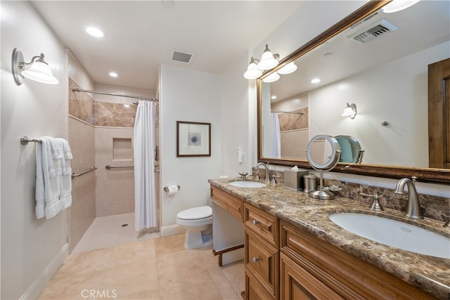 2727 Shell Beach Rd Unit 219, Pismo Beach, CA 93449 - bathroom featuring double vanity, tiled shower, recessed lighting, and tile patterned floors