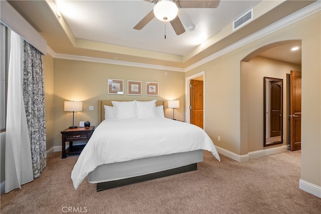 2727 Shell Beach Rd Unit 219, Pismo Beach, CA 93449 - bedroom featuring arched walkways, carpet floors, a tray ceiling, and a ceiling fan