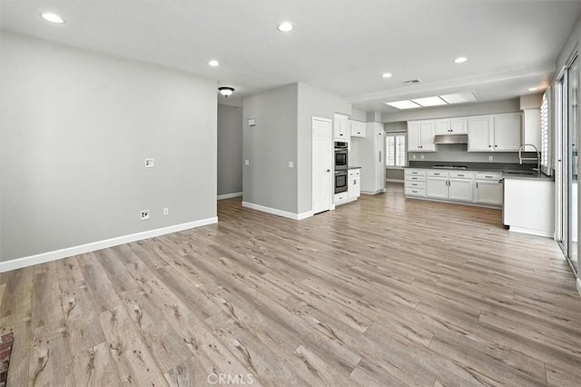 25623 Frost Ln, Stevenson Ranch, CA 91381 - unfurnished living room featuring light wood finished floors and recessed lighting