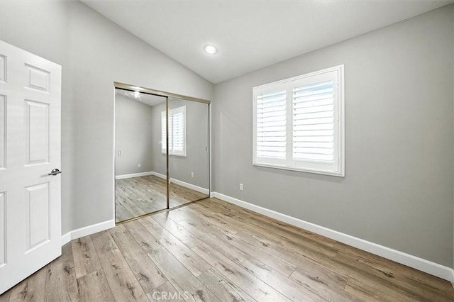 25623 Frost Ln, Stevenson Ranch, CA 91381 - unfurnished bedroom with vaulted ceiling, wood finished floors, a closet, and recessed lighting