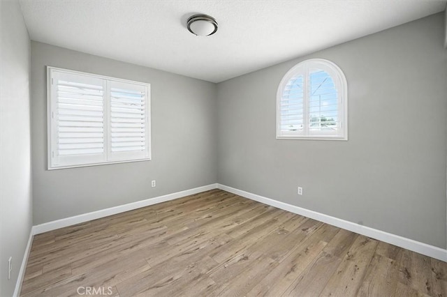 25623 Frost Ln, Stevenson Ranch, CA 91381 - unfurnished room with wood finished floors and baseboards