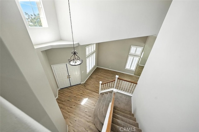 25623 Frost Ln, Stevenson Ranch, CA 91381 - entryway featuring wood finished floors, a chandelier, and stairway