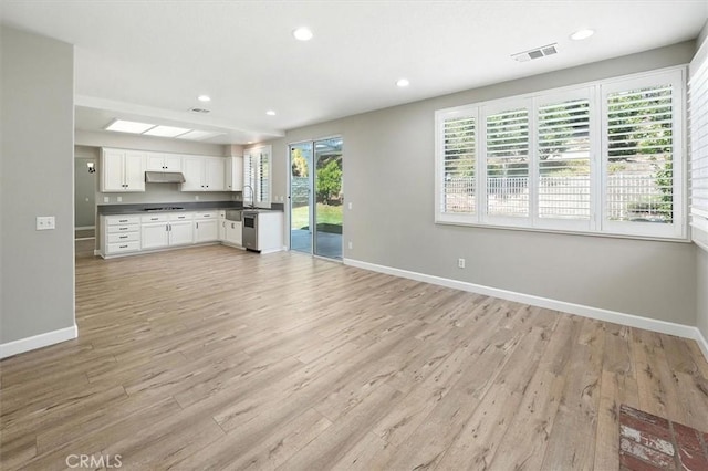 25623 Frost Ln, Stevenson Ranch, CA 91381 - unfurnished living room featuring light wood-style floors and recessed lighting