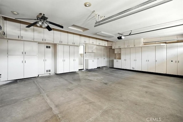 25623 Frost Ln, Stevenson Ranch, CA 91381 - garage with a garage door opener and a ceiling fan