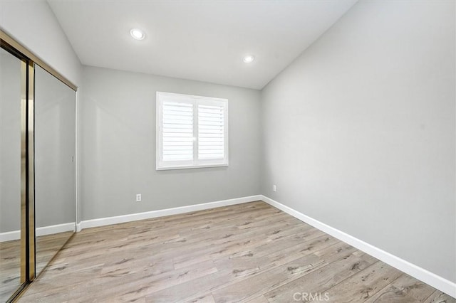 25623 Frost Ln, Stevenson Ranch, CA 91381 - unfurnished bedroom with a closet, wood finished floors, and recessed lighting