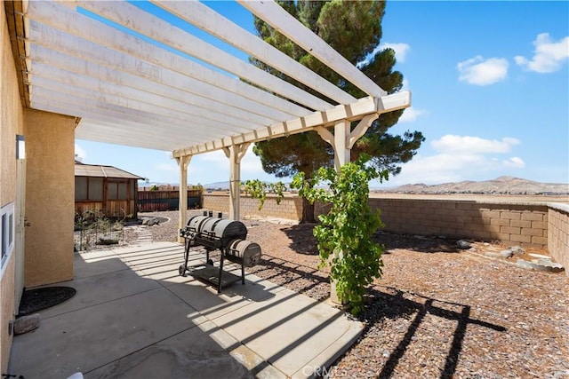 2659 Cold Creek Ave, Rosamond, CA 93560 - fenced backyard featuring a mountain view, a patio, and a pergola