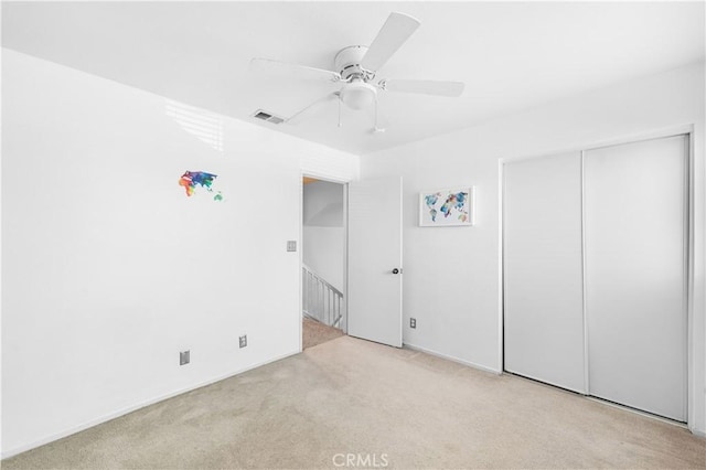 2659 Cold Creek Ave, Rosamond, CA 93560 - unfurnished bedroom with carpet, a closet, and a ceiling fan