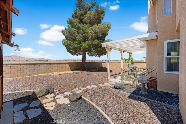 2659 Cold Creek Ave, Rosamond, CA 93560 - fenced backyard with a pergola, a patio area, and a mountain view
