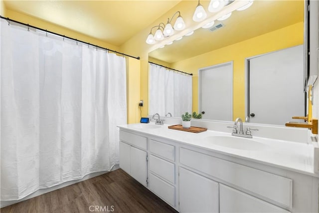 2659 Cold Creek Ave, Rosamond, CA 93560 - full bathroom with wood finished floors and double vanity