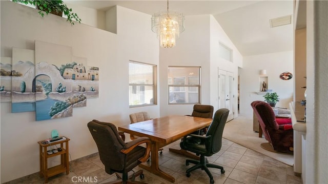 8920 Del Monte Ave, Yucca Valley, CA 92284 - dining space featuring a chandelier, high vaulted ceiling, tile patterned floors, and carpet floors