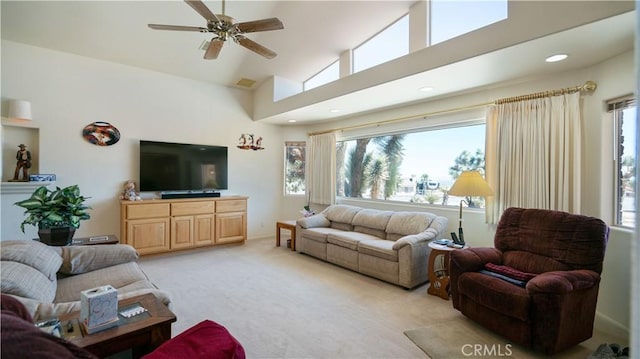 8920 Del Monte Ave, Yucca Valley, CA 92284 - living room featuring light carpet, ceiling fan, recessed lighting, and a towering ceiling