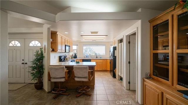 8920 Del Monte Ave, Yucca Valley, CA 92284 - kitchen featuring freestanding refrigerator, range, light countertops, open shelves, and light tile patterned floors