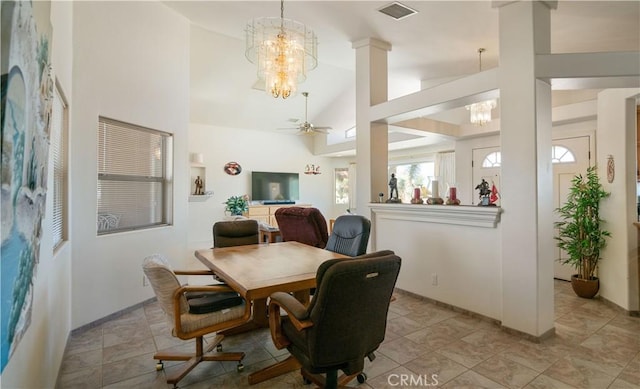 8920 Del Monte Ave, Yucca Valley, CA 92284 - dining room with a chandelier, a ceiling fan, high vaulted ceiling, and ornate columns