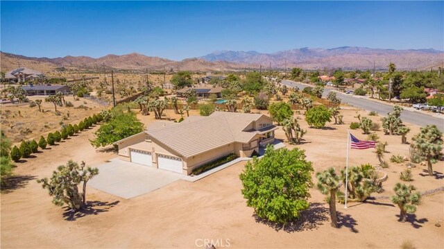 8920 Del Monte Ave, Yucca Valley, CA 92284 - aerial view of property and surrounding area with mountains